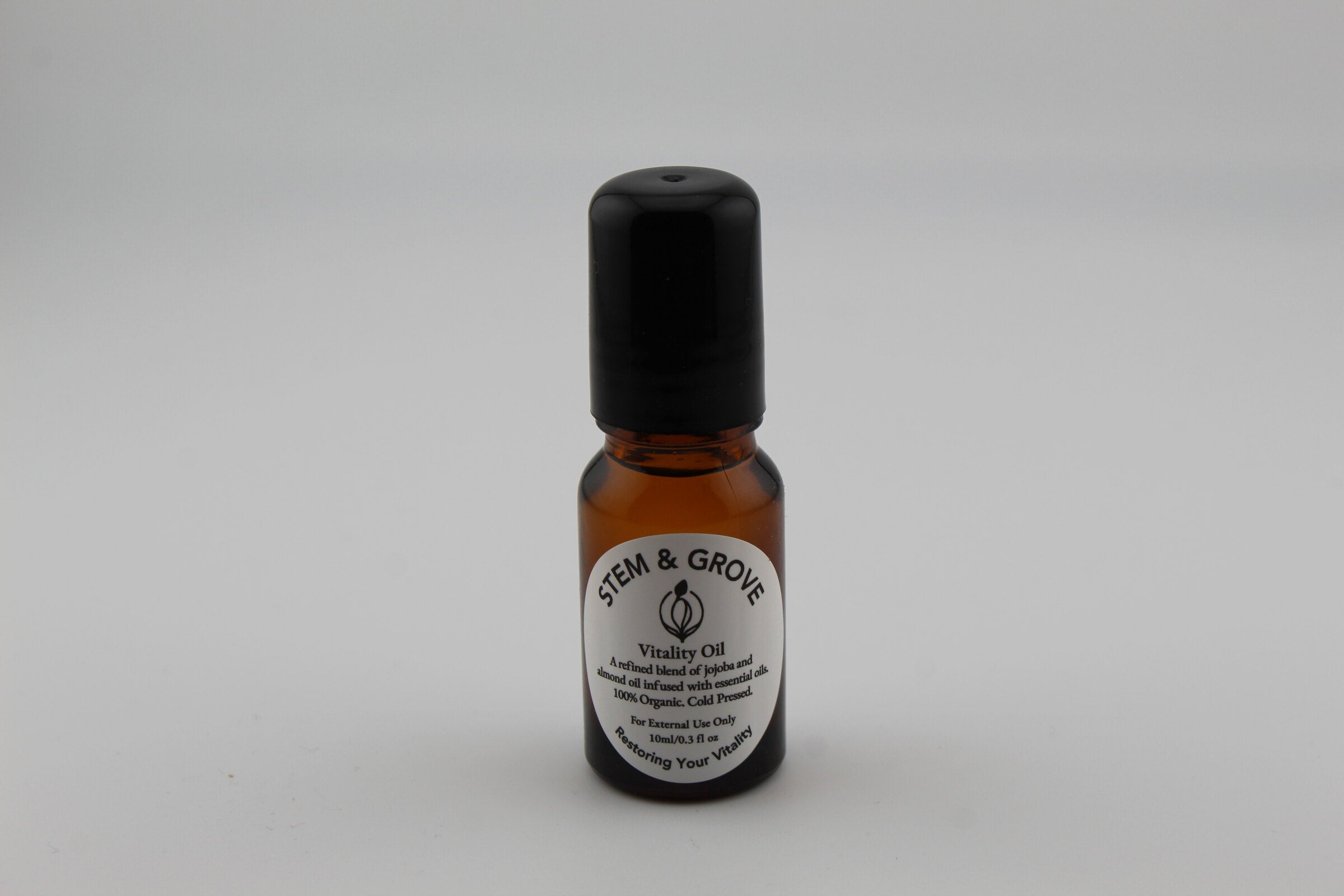 Stem & Grove Vitality Oil amber roll-on bottle, front label