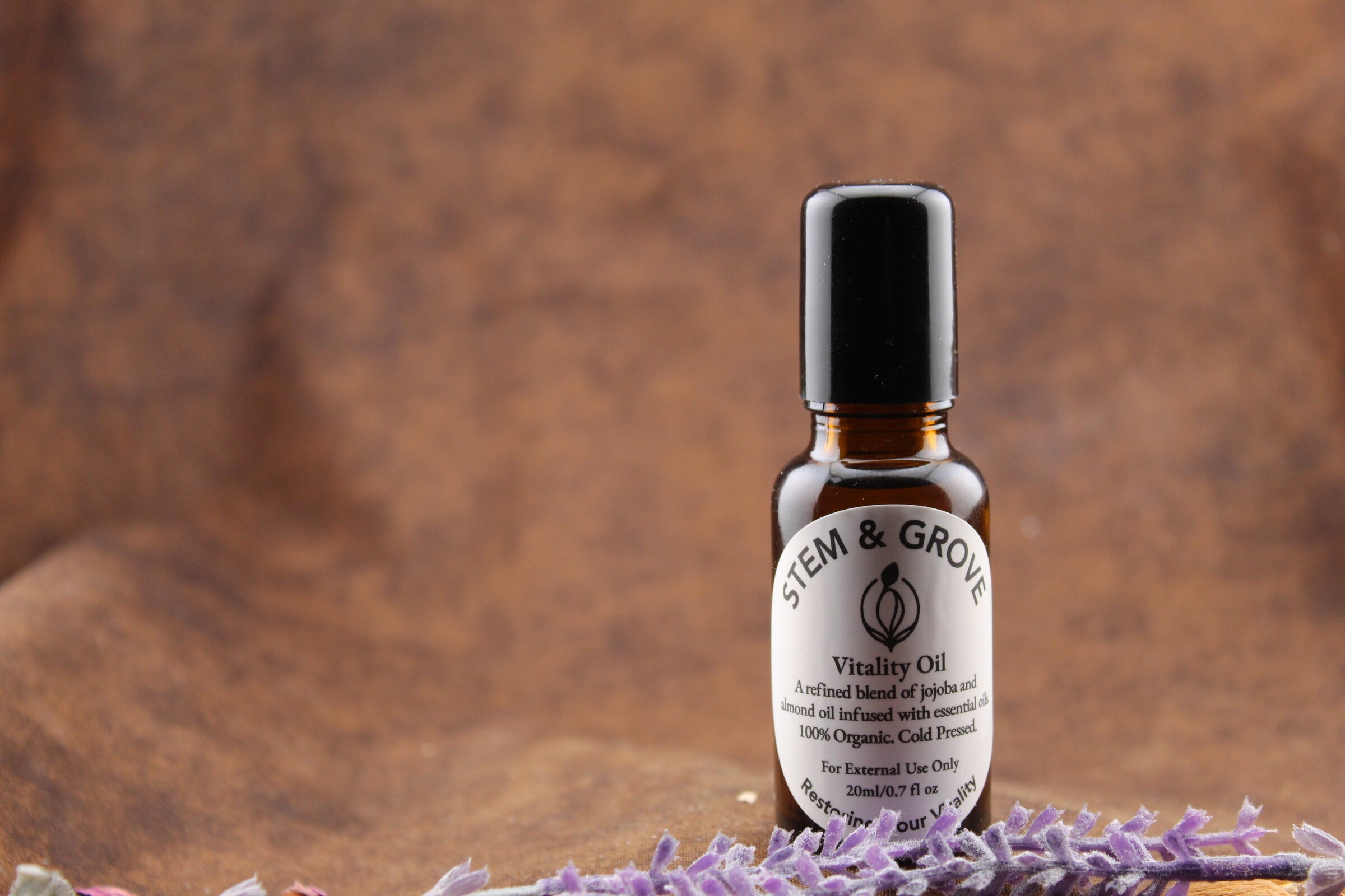 Stem & Grove Vitality Oil styled with fresh lavender